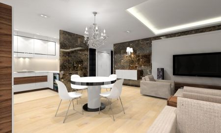 W strefie dziennej przykuwają wzrok ściany pokryte dekoracyjnym marmurem emperador dark.