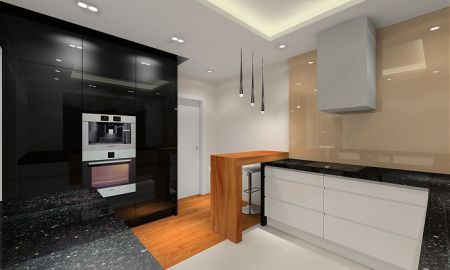 W kuchni wysokie słupki pokryto czarnym lakierem.