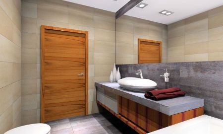 Kontrastowe zestawienie płytek jasnych z szarymi. MKdezere - projektowanie wnętrz