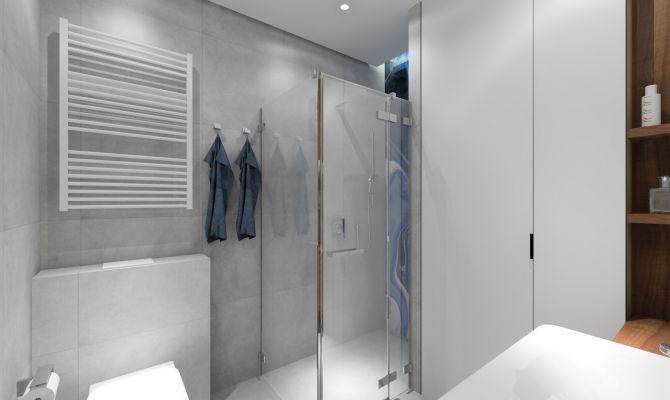 Łazienka z szarymi płytkami z kabiną prysznicową. Szkło dekoracyjne w kabinie.