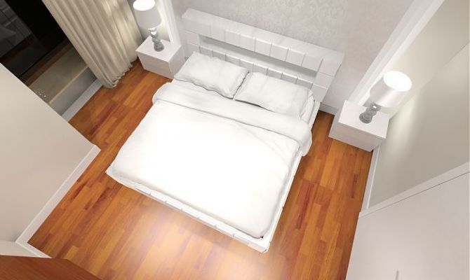 Sypialnia z podłogą z ciepłego drewna iroko.