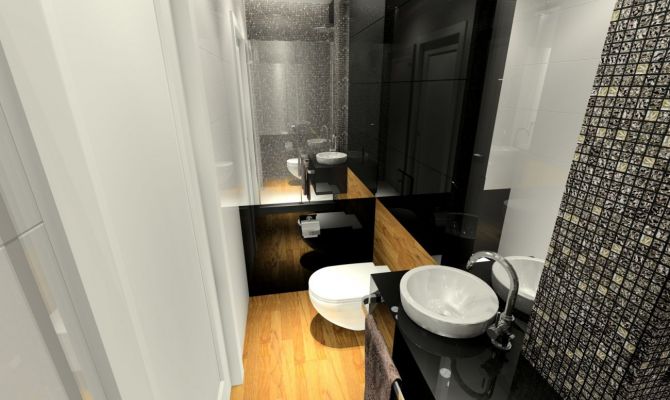 W małej łazience dla gości zastosowano czarne szkło połączone z mozaiką Dell'Arte .