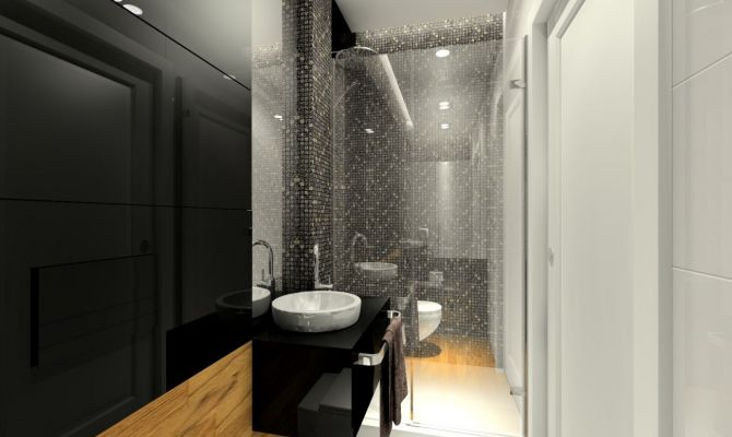 W małej łazience dla gości zastosowano czarne szkło połączone z mozaiką Dell'Arte.