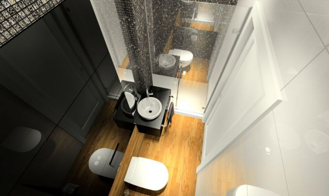 W małej łazience dla gości zastosowano czarne szkło połączone z mozaiką Dell'Arte.