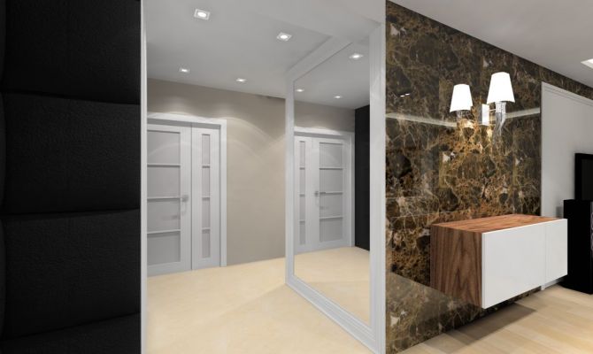 W strefie dziennej przykuwają wzrok ściany pokryte dekoracyjnym marmurem emperador dark.