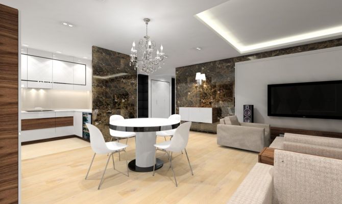 W strefie dziennej przykuwają wzrok ściany pokryte dekoracyjnym marmurem emperador dark.