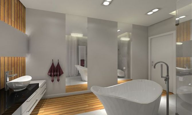 Aby powiększyć i podnieść rangę łazienki zastosowano duże lustra na których umieszczono kryształowe kinkiety.