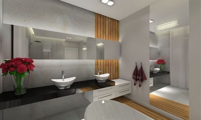 W łazience zastosowano płytki z trawertynu oraz deskę teak.