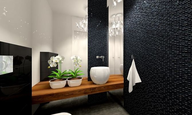 Czarna mozaika w tym projekcie dla kontrastu została połączona z białą błyszczącą płytką gresową