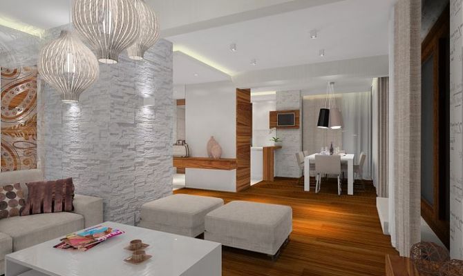 Projekt przytulnego apartamentu z dodatkiem naturalnego kamienia oraz szklaną przesłoną oddzielającą salon od holu. Na filarze dekoracyjny 