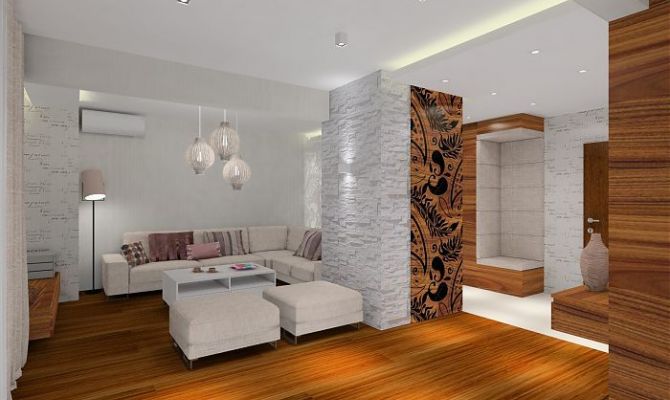 Projekt przytulnego apartamentu z dodatkiem naturalnego kamienia oraz szklaną przesłoną oddzielającą salon od holu. Na filarze dekoracyjny 