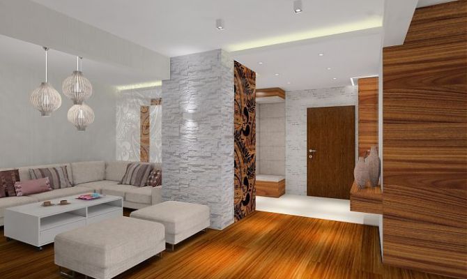 Projekt przytulnego apartamentu z dodatkiem naturalnego kamienia oraz szklaną przesłoną oddzielającą salon od holu. Na filarze dekoracyjny 