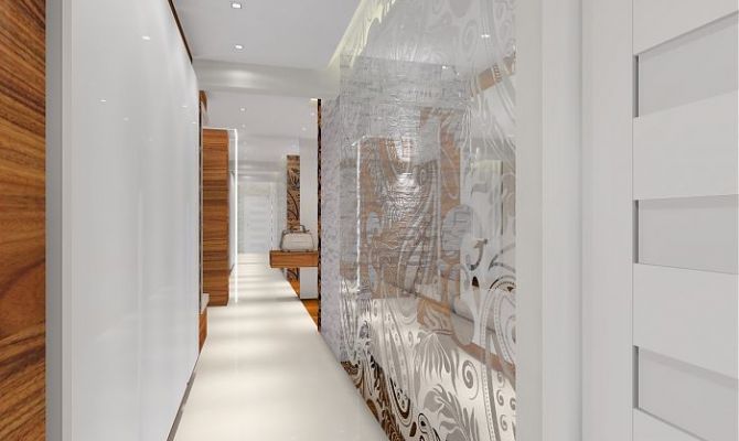 Projekt przytulnego apartamentu z dodatkiem naturalnego kamienia oraz szklaną przesłoną oddzielającą salon od holu. Na filarze dekoracyjny 