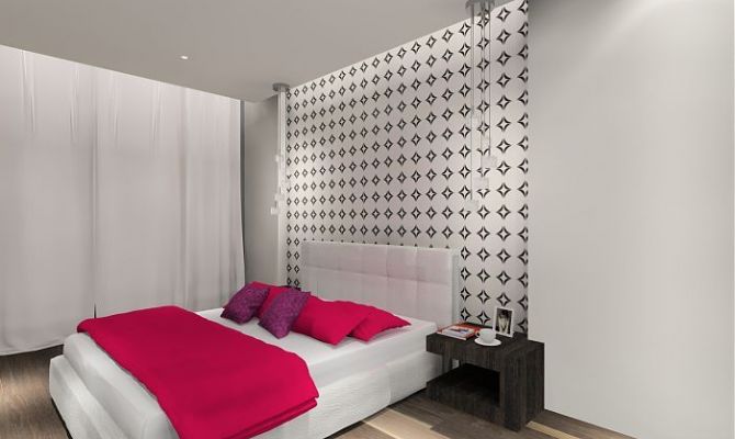 Sypialnia z graficzną tapetą